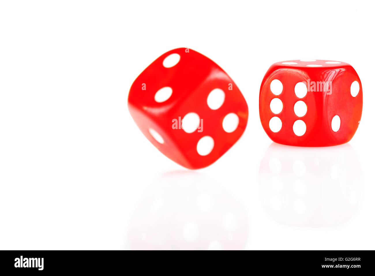 Pair of red dice isolated on white background with reflection Stock Photo