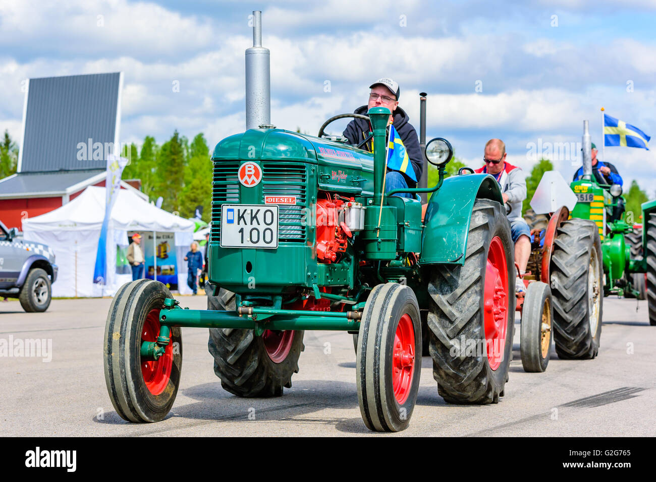 Emmaboda, Sweden - May 14, 2016: Forest and tractor (Skog och traktor) fair. Vintage classic tractors on parade. Here a green an Stock Photo