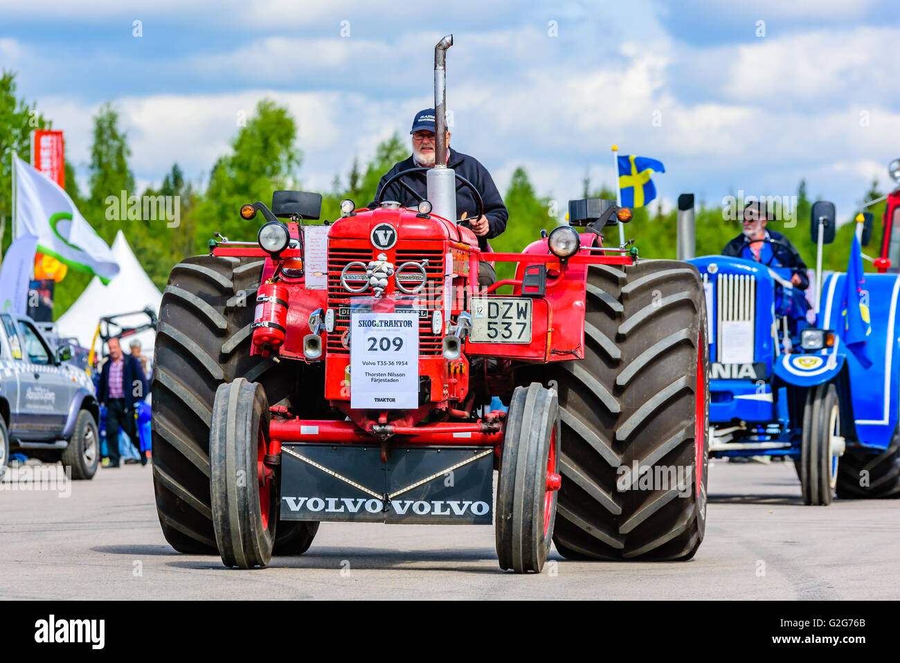 Emmaboda, Sweden - May 14, 2016: Forest and tractor (Skog och traktor) fair. Vintage classic tractors on parade. Here a red 1954 Stock Photo