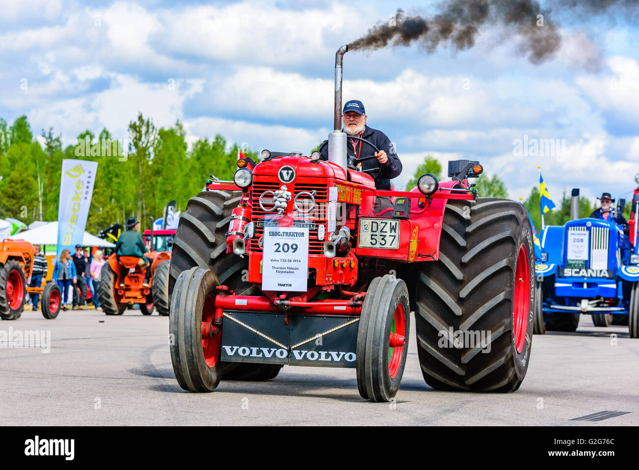 Emmaboda, Sweden - May 14, 2016: Forest and tractor (Skog och traktor) fair. Vintage classic tractors on parade. Here a red 1954 Stock Photo