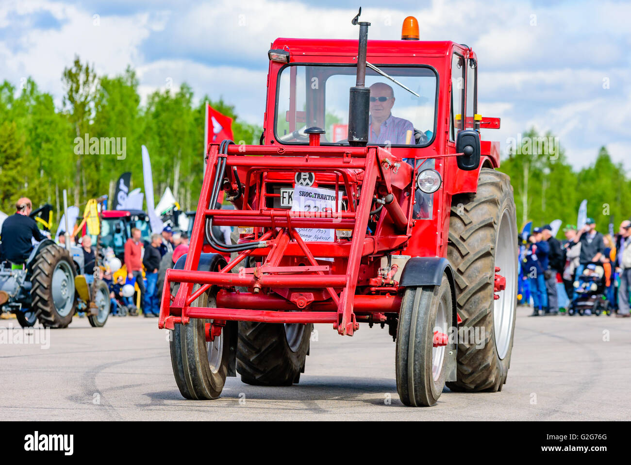 Emmaboda, Sweden - May 14, 2016: Forest and tractor (Skog och traktor) fair. Vintage classic tractors on parade. Here a red 1959 Stock Photo