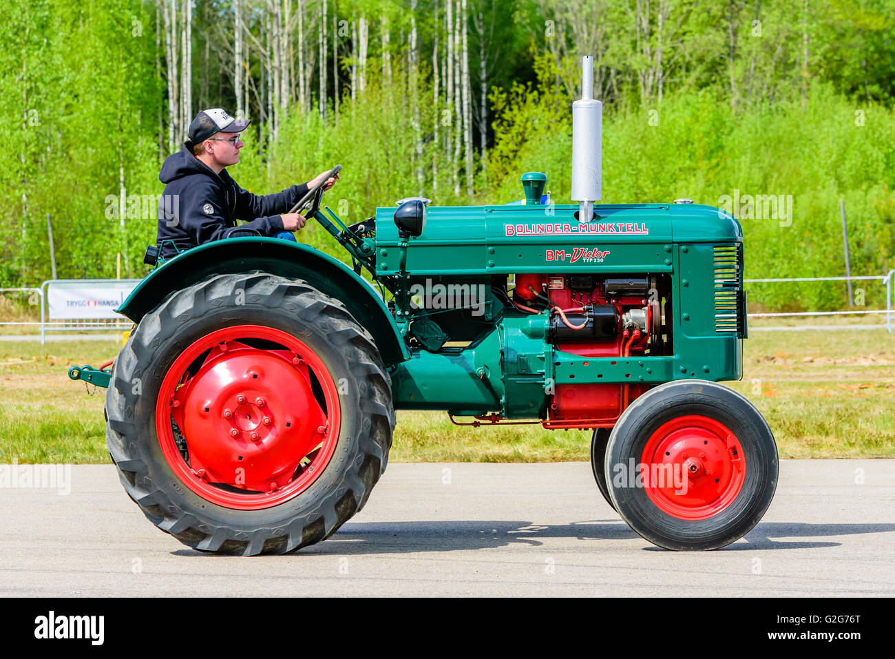 Emmaboda, Sweden - May 14, 2016: Forest and tractor (Skog och traktor) fair. Vintage classic tractors on parade. Here a green an Stock Photo
