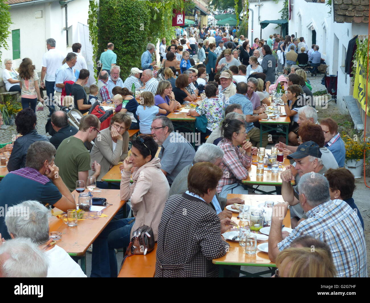 Austria - Hausdorf. Lower Austria. Wein Viertel, Wein region. Village people gather together on the street and enjoy local wine. Stock Photo