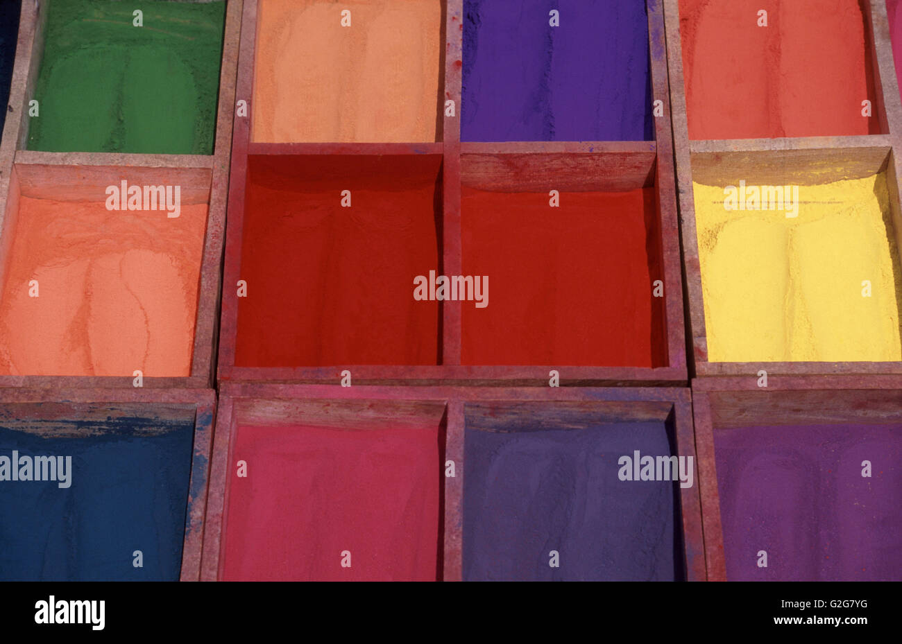 Different color pigments arranged in boxes. Stock Photo