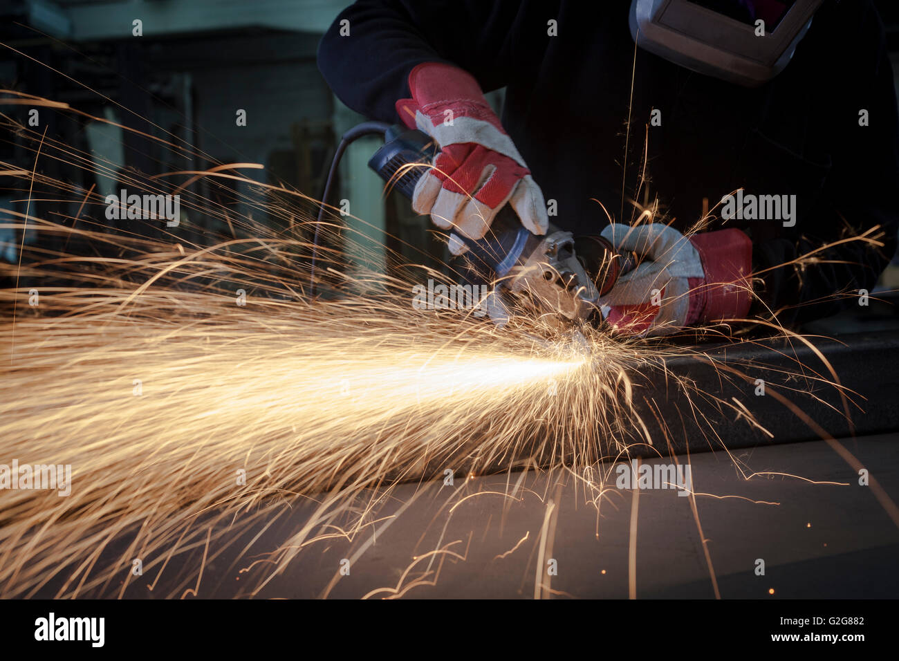 Grinding closeup with protection gloves and sparks Stock Photo Alamy