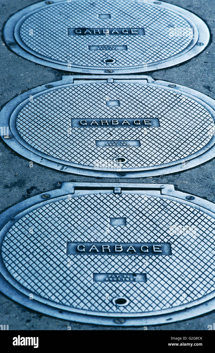 USA Louisiana, New Orleans. Cast iron covers with "garbage" written