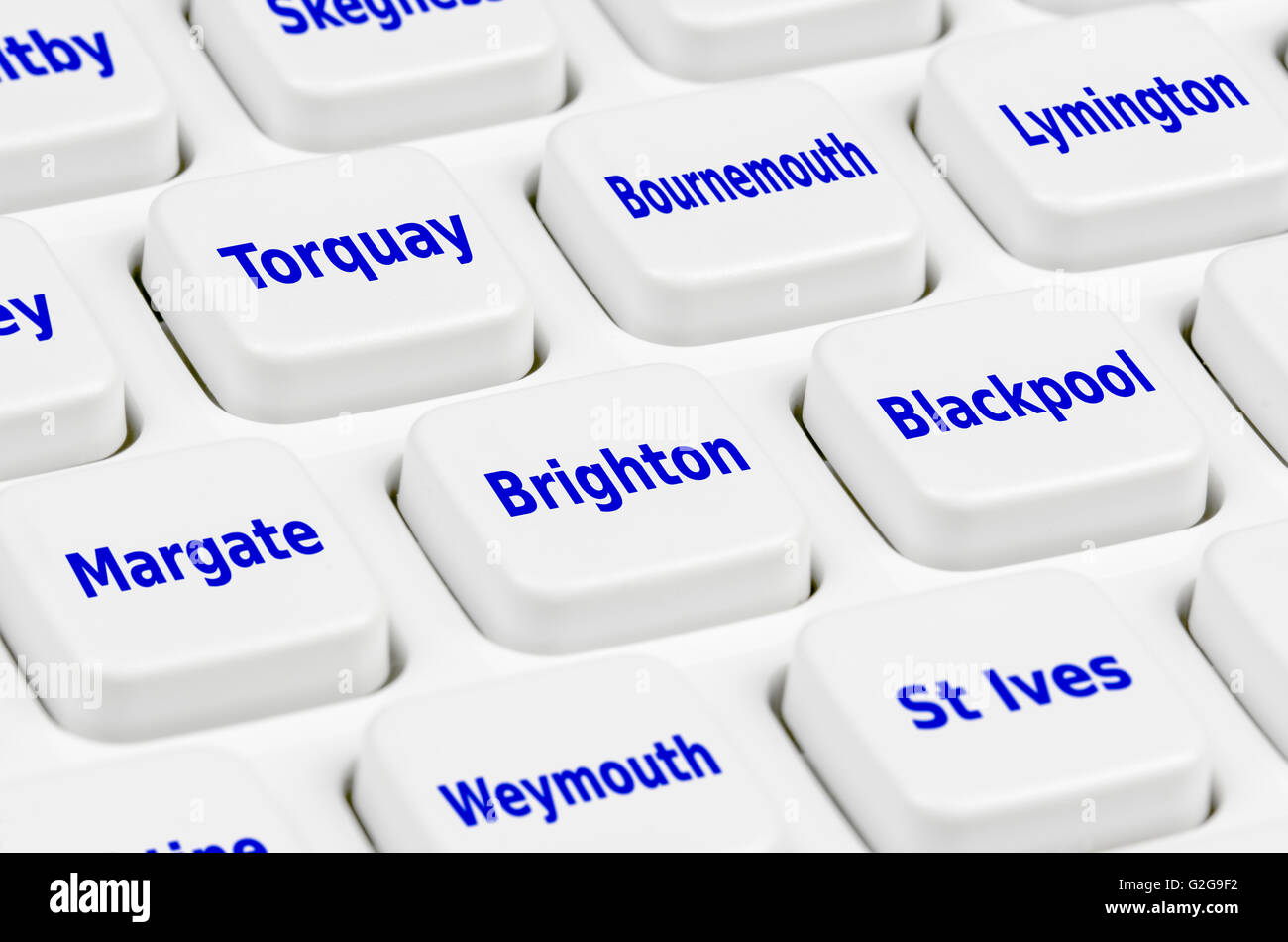 UK holiday destination options on a computer keyboard. Stock Photo