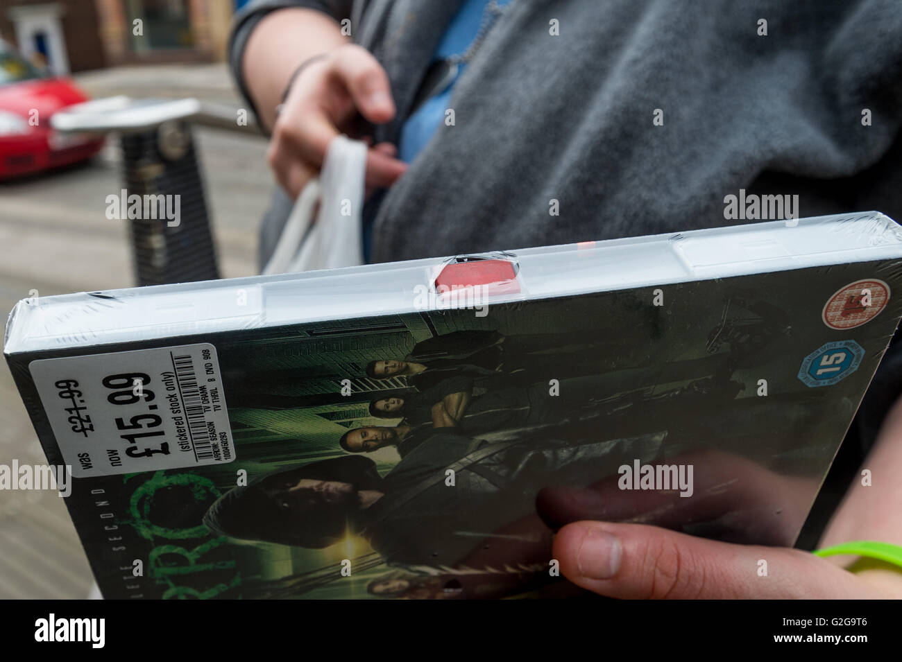 Shoplifter Starts To Remove Security From A Stolen Dvd Stock Photo Alamy Shoplifter Starts To Remove Security From A Stolen Dvd Stock Photo Alamy