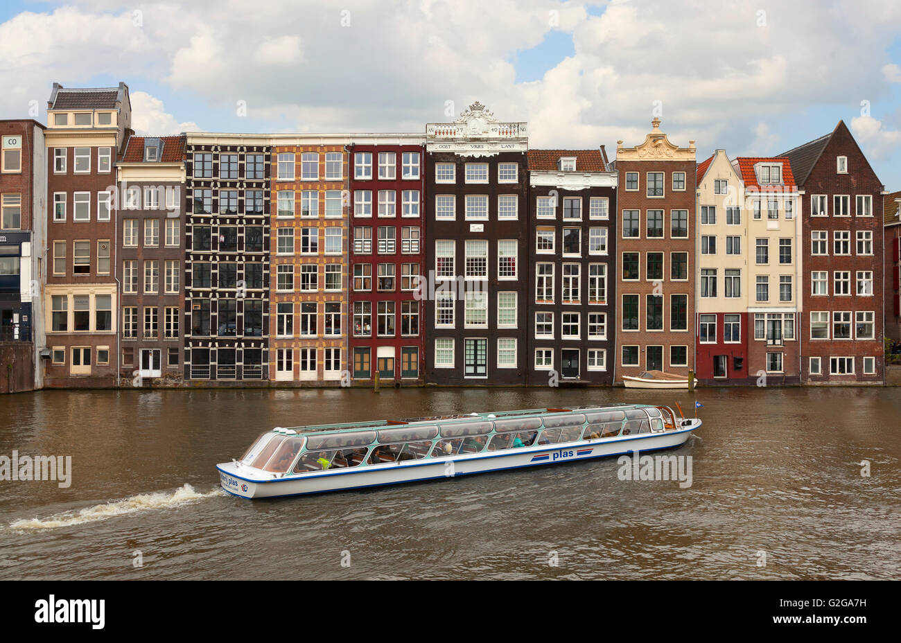 Amsterdam architecture, view from the Damrak looking East, The dancing canal or grachtenhuizen Stock Photo