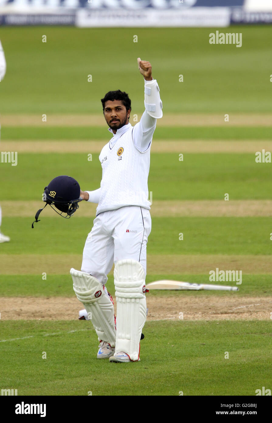 Sri Lanka's Dinesh Chandimal celebrates his 100 during day four of the Investec Second Test Match at the Emirates Riverside, Chester-Le-Street. Stock Photo