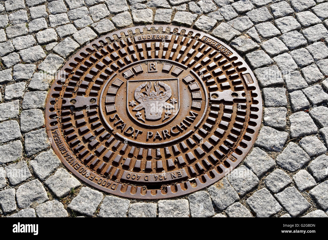 Man-hole cover with inscription, 'Stadt Parchim', Parchim, Mecklenburg-Western Pomerania, Germany Stock Photo