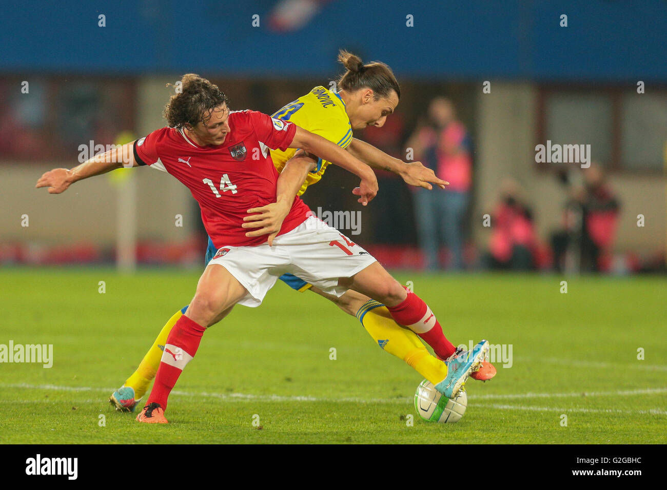 Julian Baumgartlinger, No. 14 Austria, and Zlatan Ibrahimovic, No. 10 Sweden, fight for the ball during the world cup qualifier Stock Photo