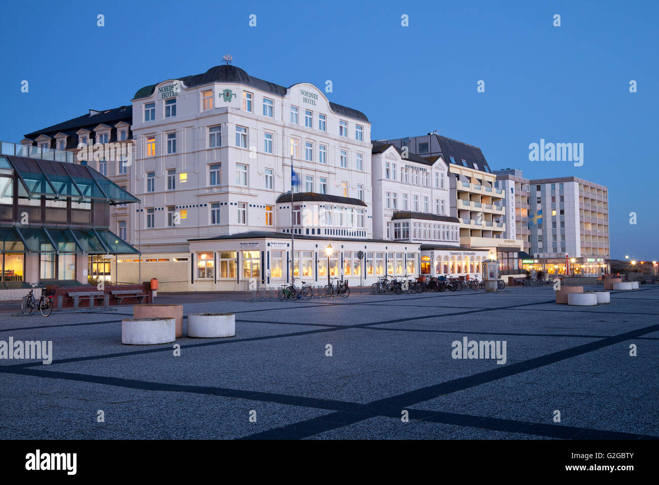 Hotels along the beach promenade at dusk, Borkum, East Frisian Islands, East Frisia, Lower Saxony, Germany Stock Photo