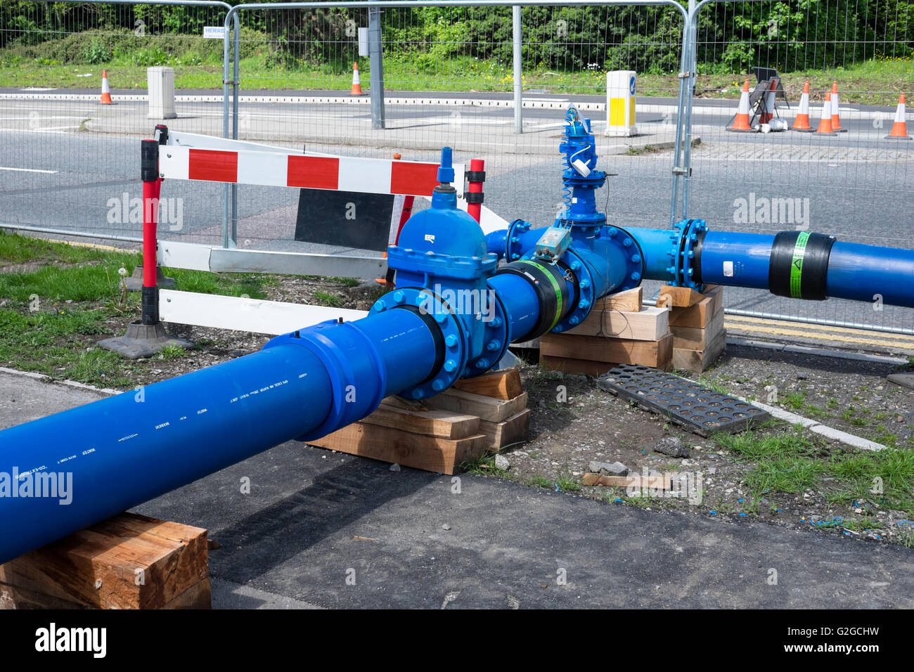 A blue temporary water main pipe Stock Photo