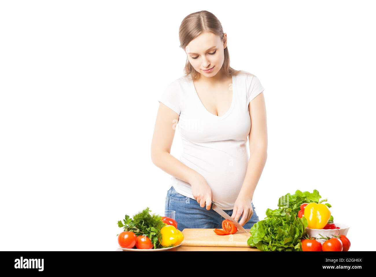 Pregnant woman cooking food in hi-res stock photography and images - Alamy