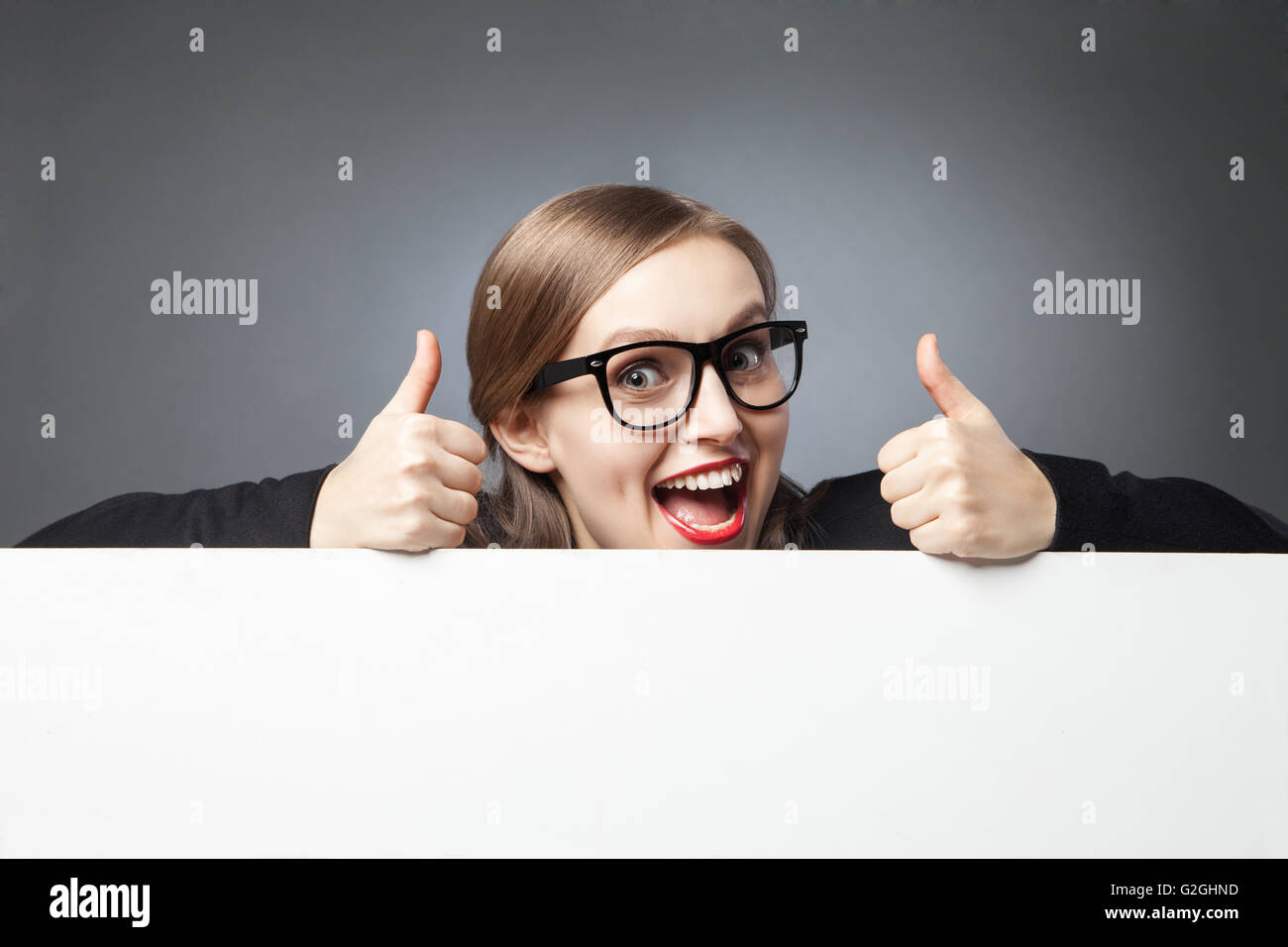 happy woman showing thumbs up Stock Photo - Alamy