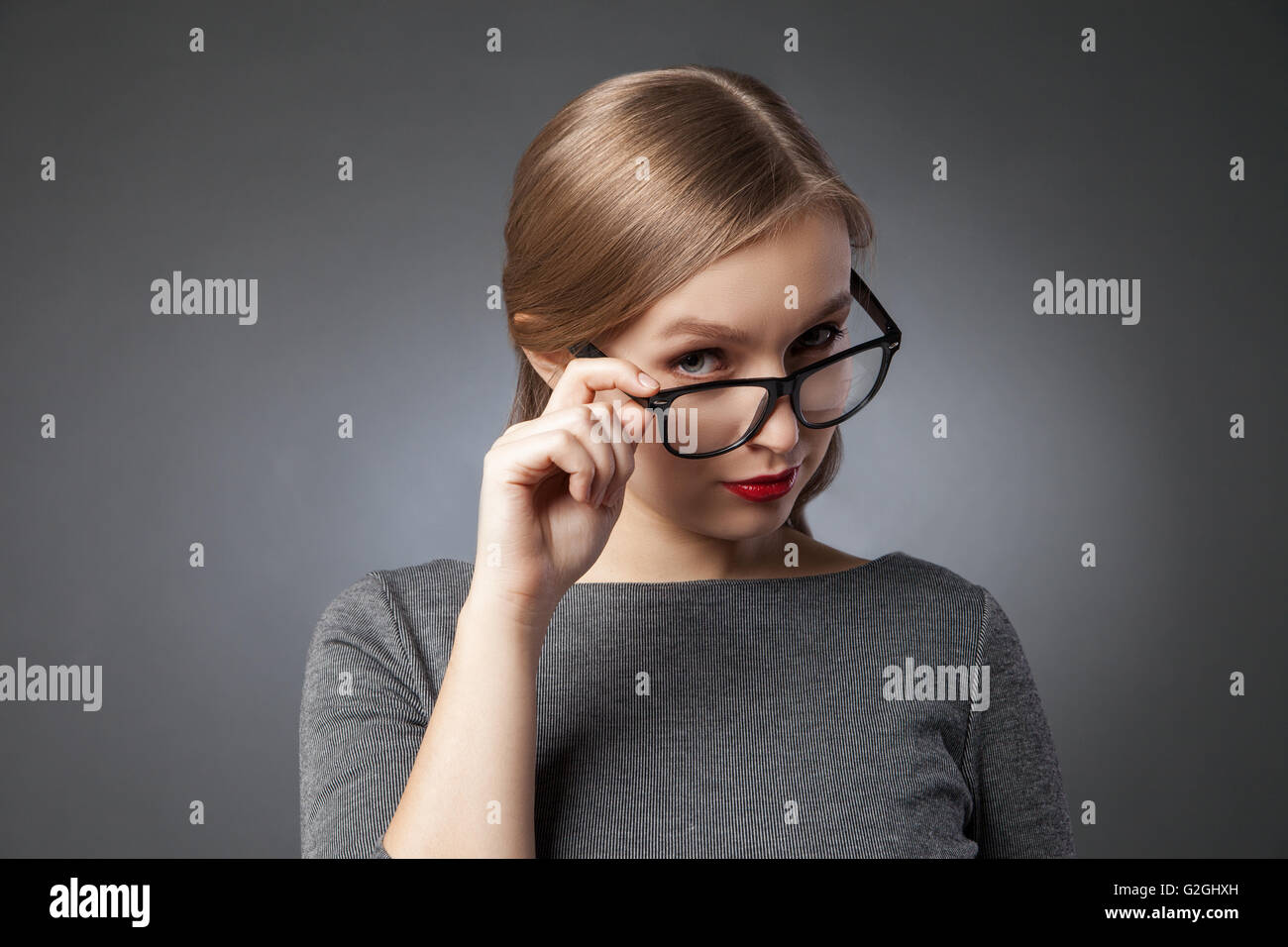 Beautiful woman looking at camera with playful look Stock Photo