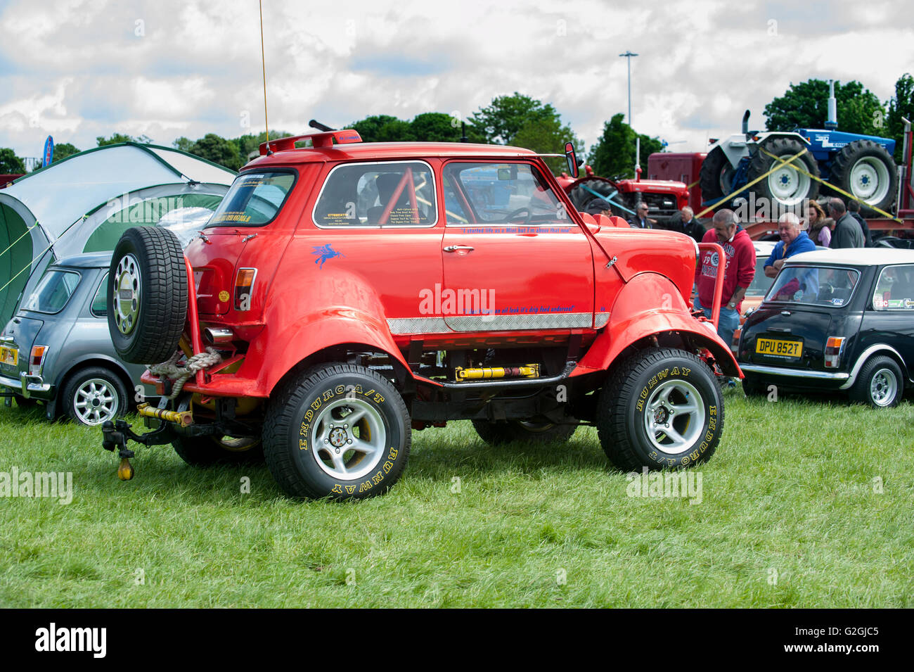 A "Monster Truck Style" Mini Minor car on show at a summer fair in the UK Stock Photo