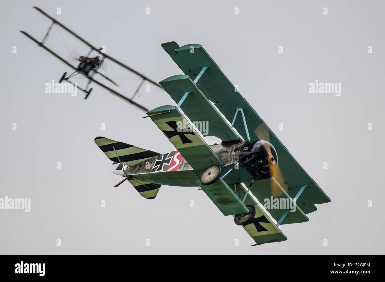 An allied S.E.5 gets on to the tail of a Fokker Dr.1 during a First World War dogfight re-enactment at an air display Stock Photo