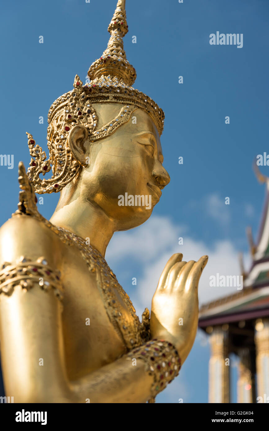 Golden statue of mythical deity Kinnorn (Kinnara) at Wat Phra Kaew Temple, Grand Palace, Bangkok, Thailand Stock Photo