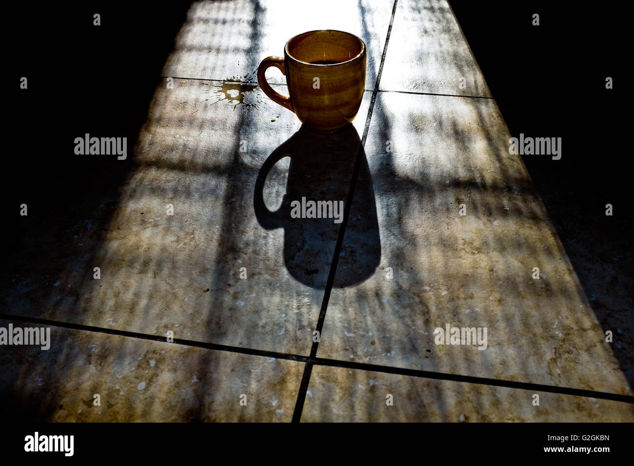coffee-mug-with-shadow-on-tile-floor-G2G