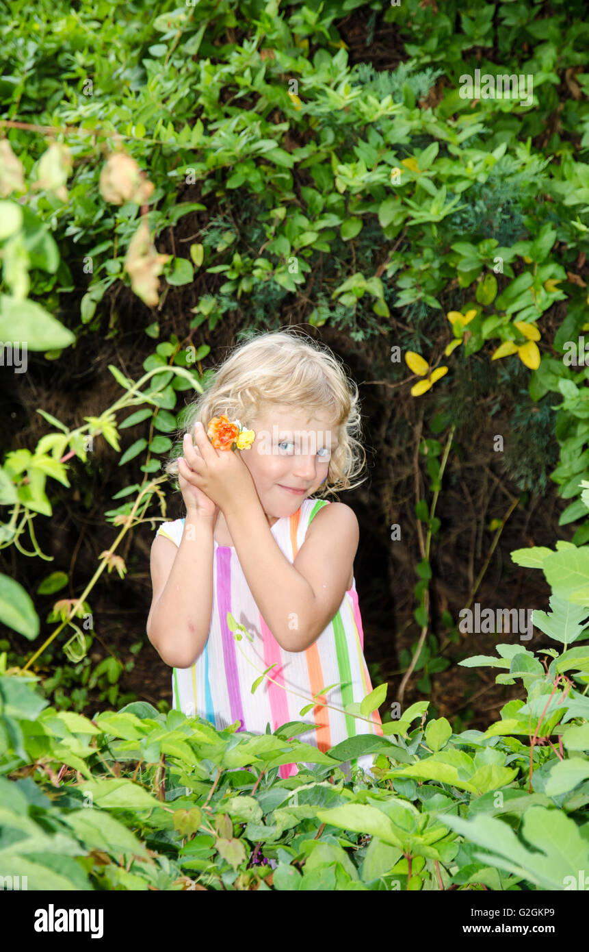 beautiful blond girl on green background Stock Photo - Alamy