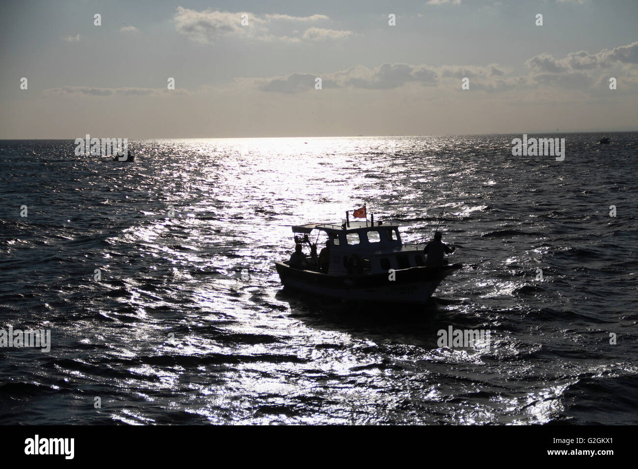 Silhouette fishing boat hi-res stock photography and images - Alamy