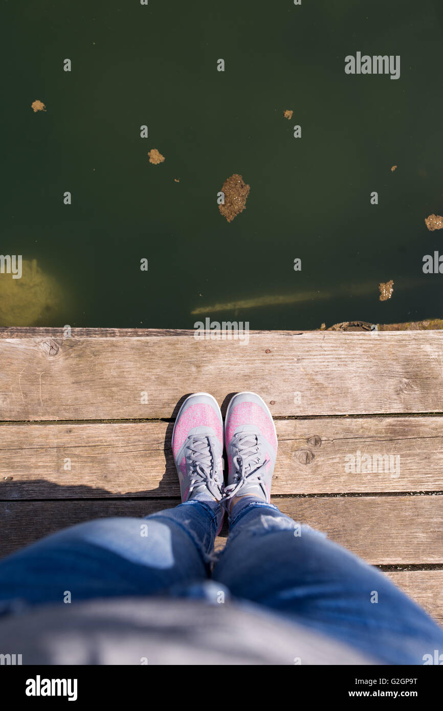 Crossed legs standing hi-res stock photography and images - Alamy