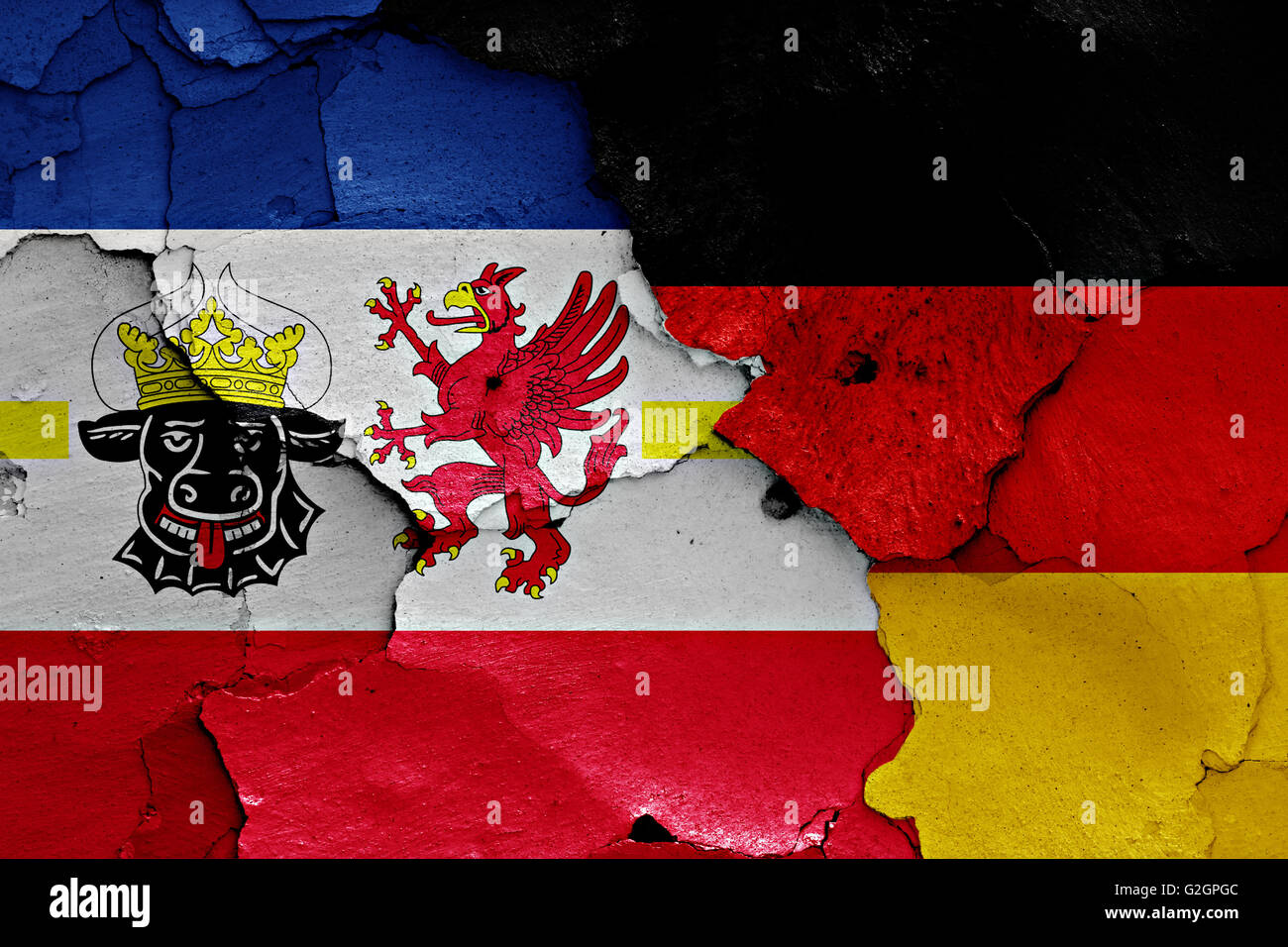 flags of Mecklenburg Vorpommern and Germany painted on cracked wall Stock Photo