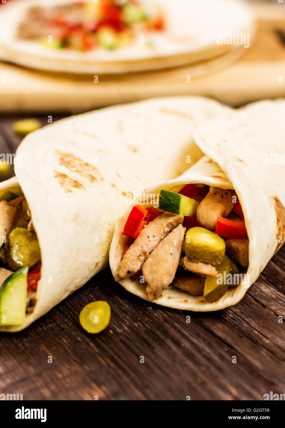 Traditional mexican tortilla wrap with meat and vegetables Stock Photo