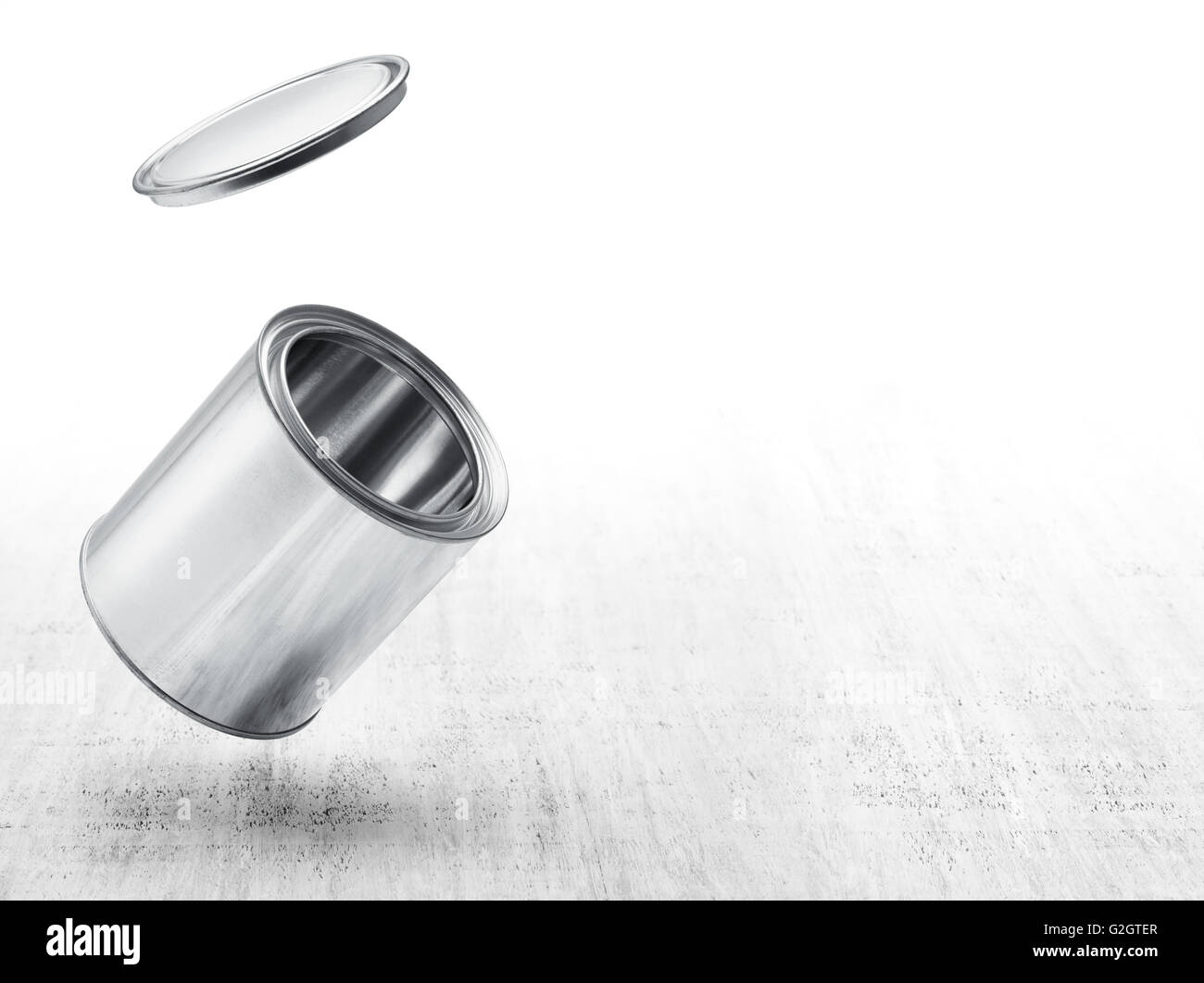 paint tin with open lid against white wood background Stock Photo Alamy