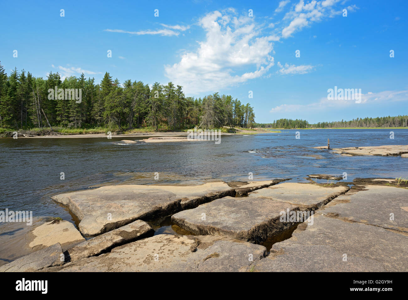 Rocky shoreline along the Bloodvein River Bloodvein Manitoba Canada Stock Photo