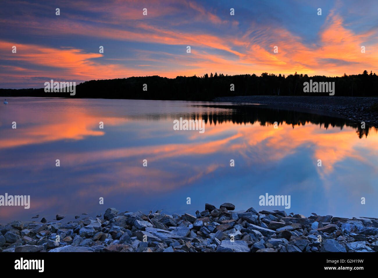 Sunrise reflection on Lac Seul Ear Falls Ontario Canada Stock Photo