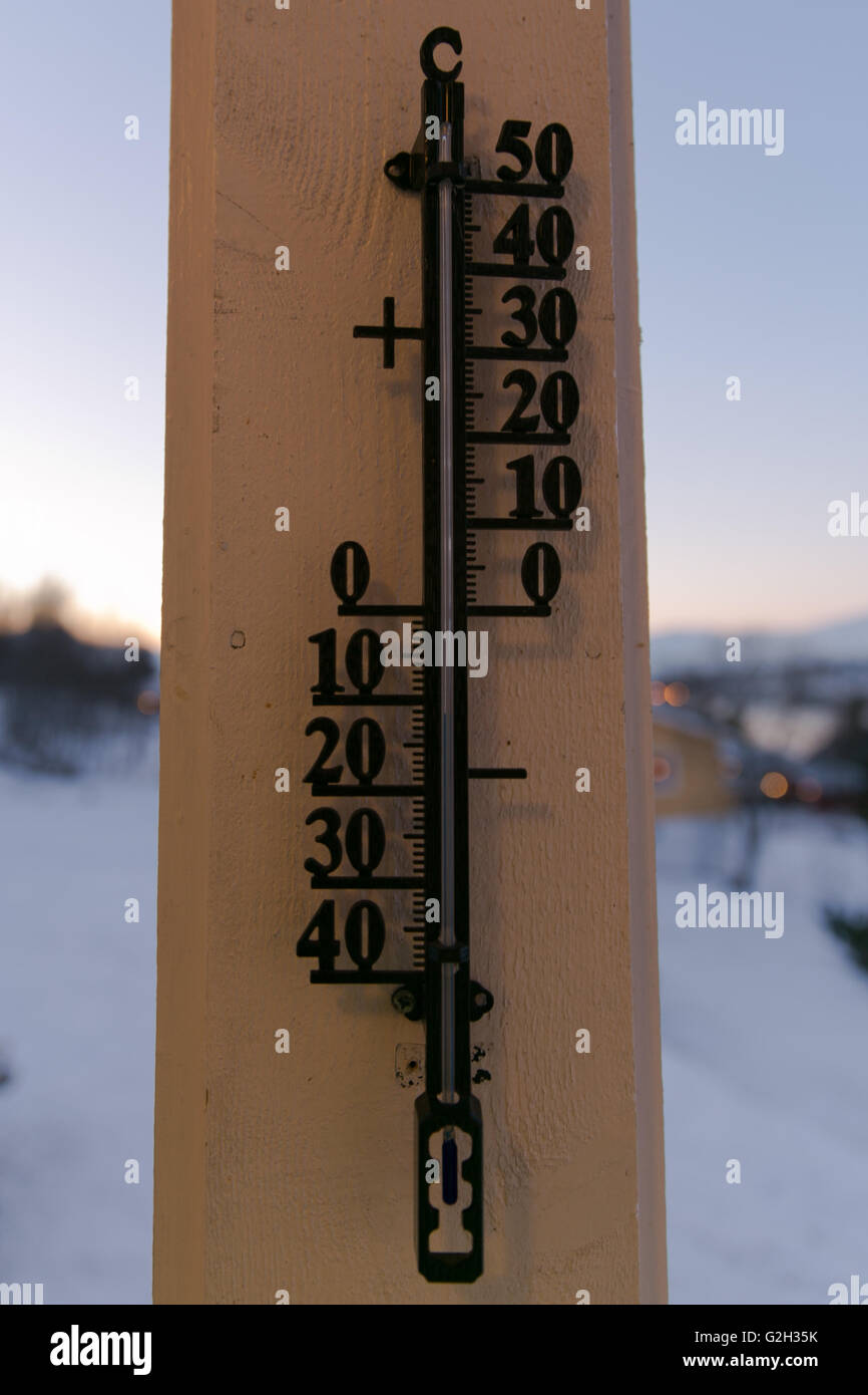 Thermometer in the cold Stock Photo