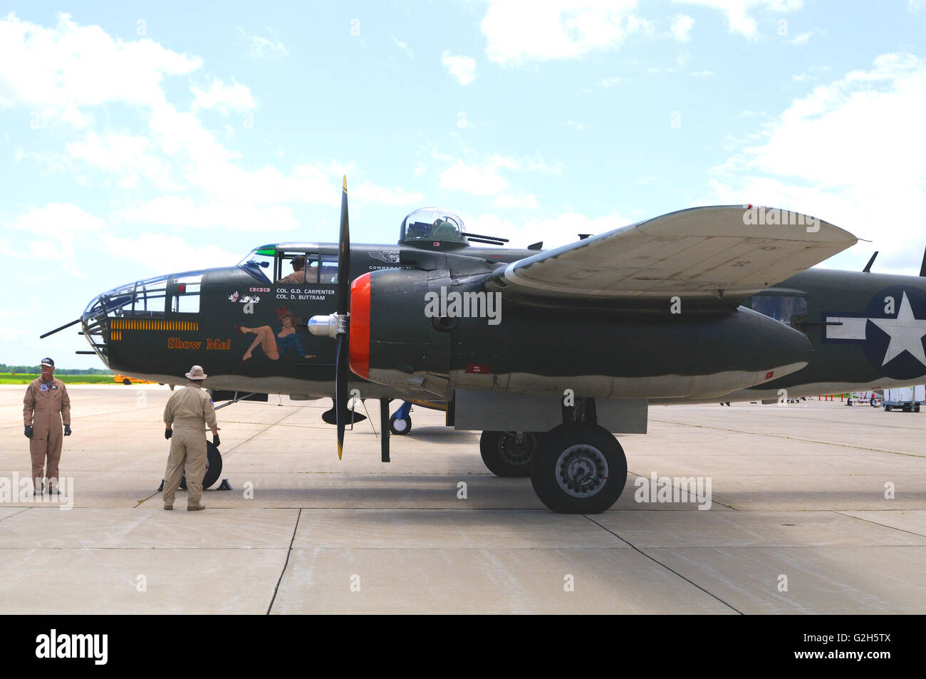 A World War II era B-25 light bomber with nose art displayed at an airshow Stock Photo