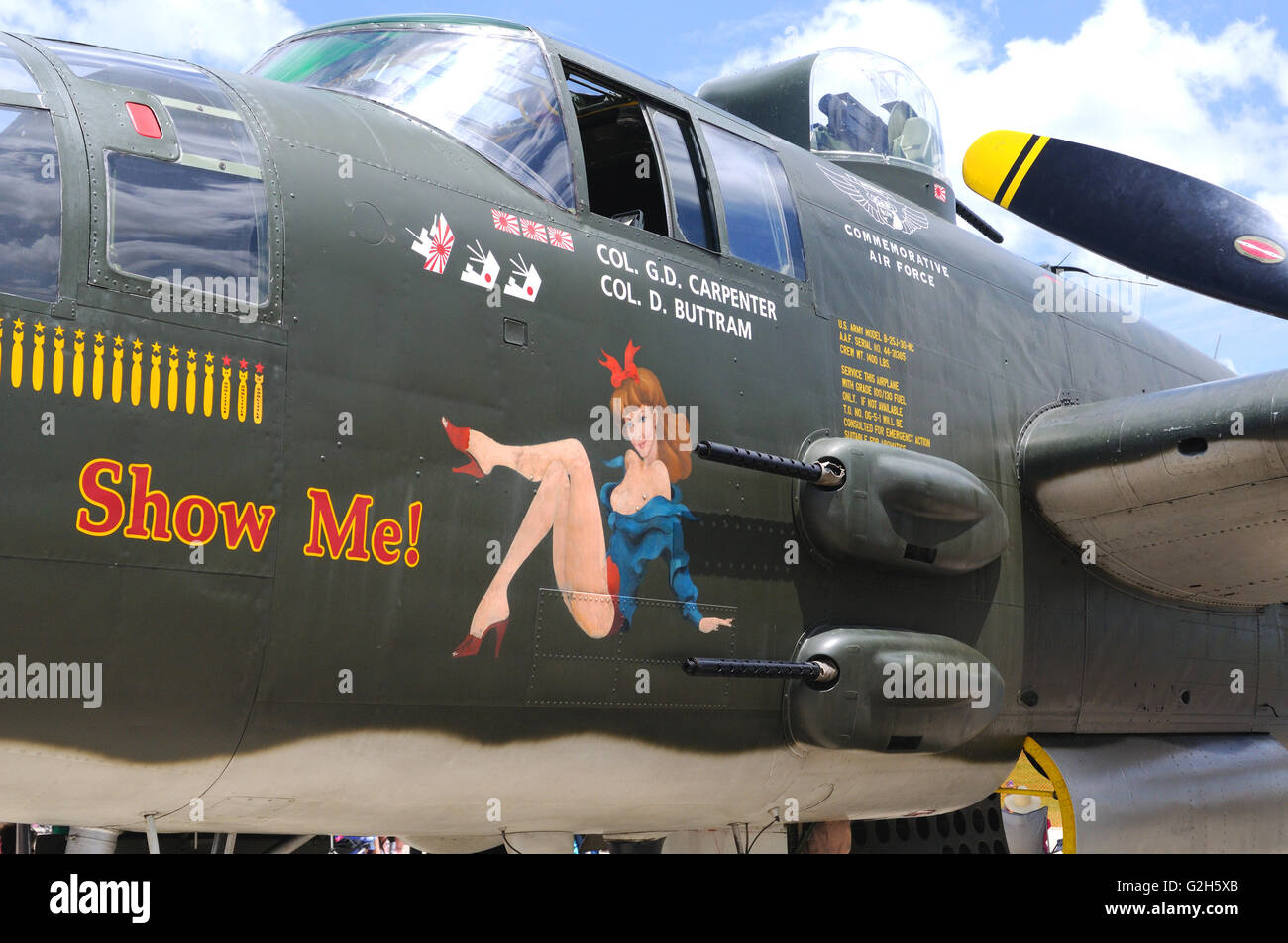 A World War II era B-25 light bomber with nose art displayed at an airshow Stock Photo