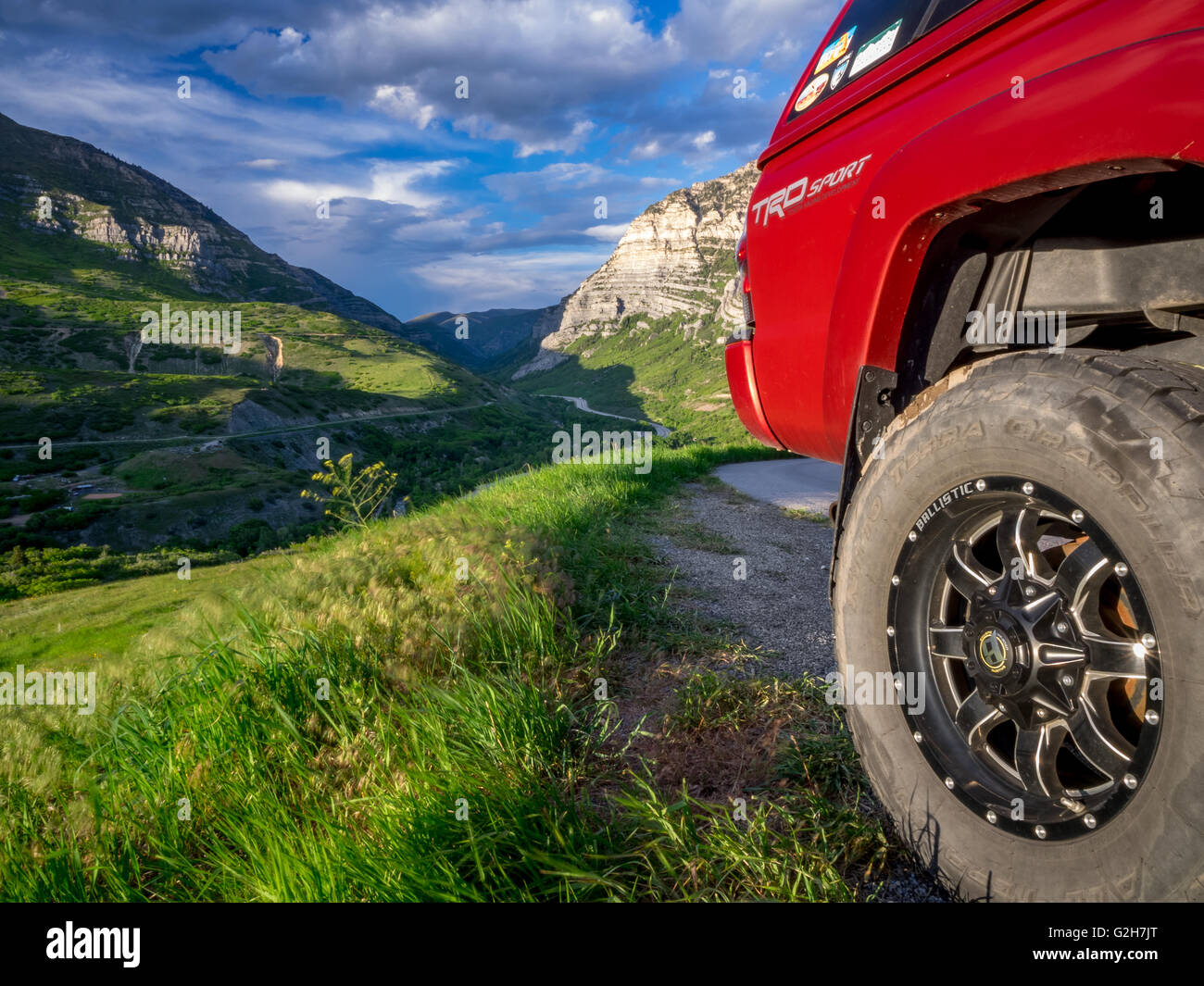Back of a red truck over looking the Provo canyon in the Wasatch Mountain range going up Squaw Peak road.. Stock Photo