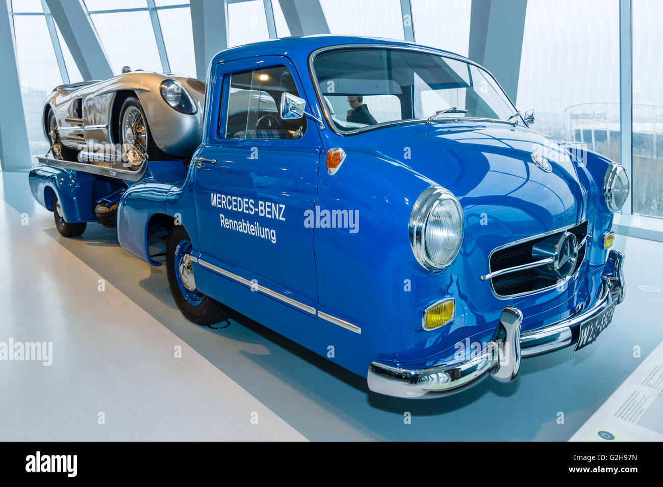 The high-speed racing car transporter Mercedes-Benz (Blue Wonder) and racing sports car Mercedes-Benz 300 SLR on the trailer. Stock Photo