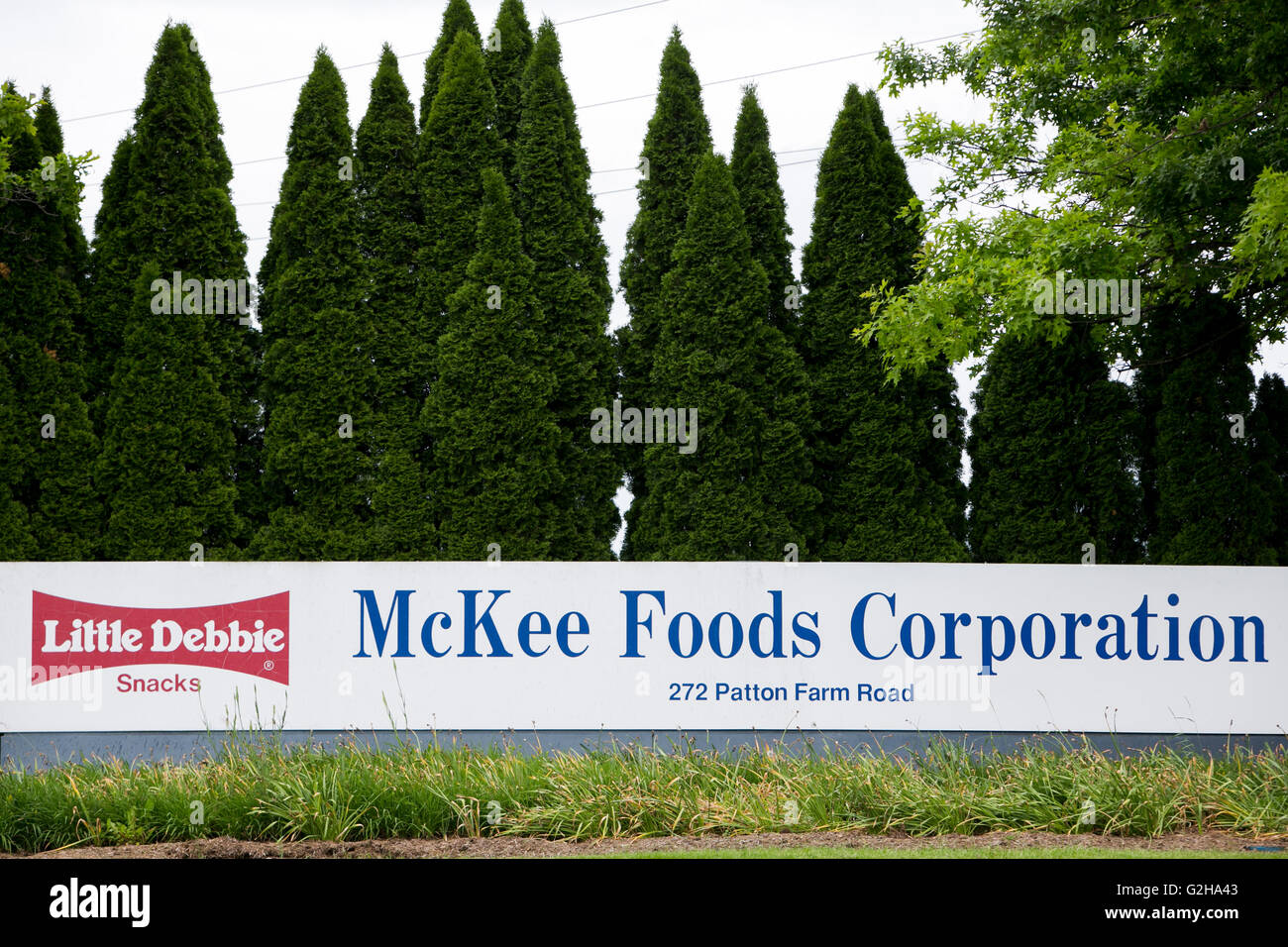 A logo sign outside of a facility occupied by the McKee Foods Corporation, parent company of Little Debbie snacks, in Stuarts Dr Stock Photo