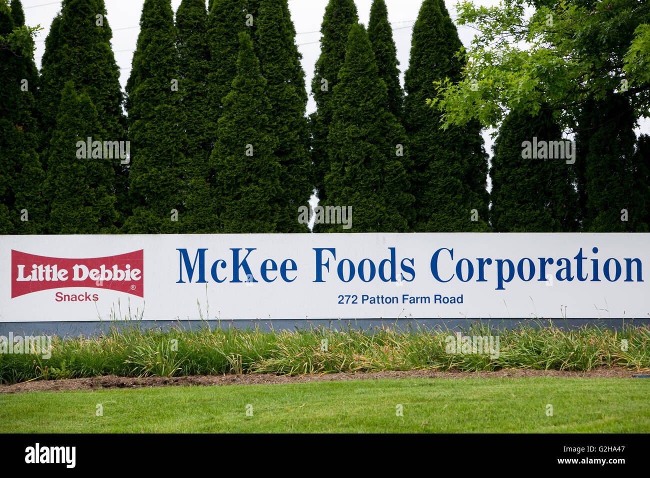 A logo sign outside of a facility occupied by the McKee Foods Corporation, parent company of Little Debbie snacks, in Stuarts Dr Stock Photo