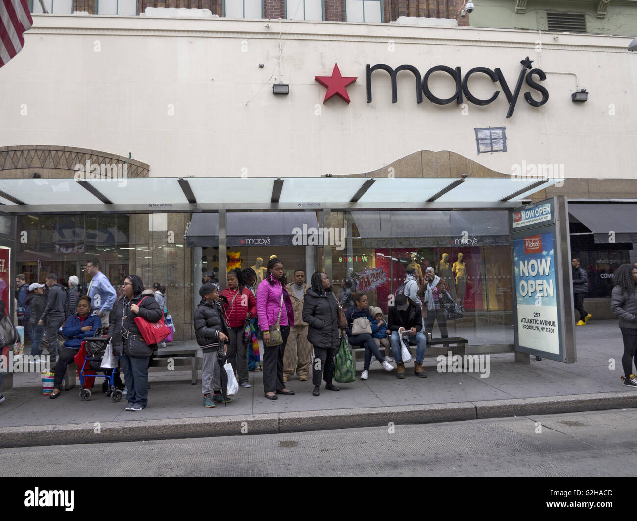 Shoppers wait for bus home at Albee Square mall in Downtown Brooklyn in