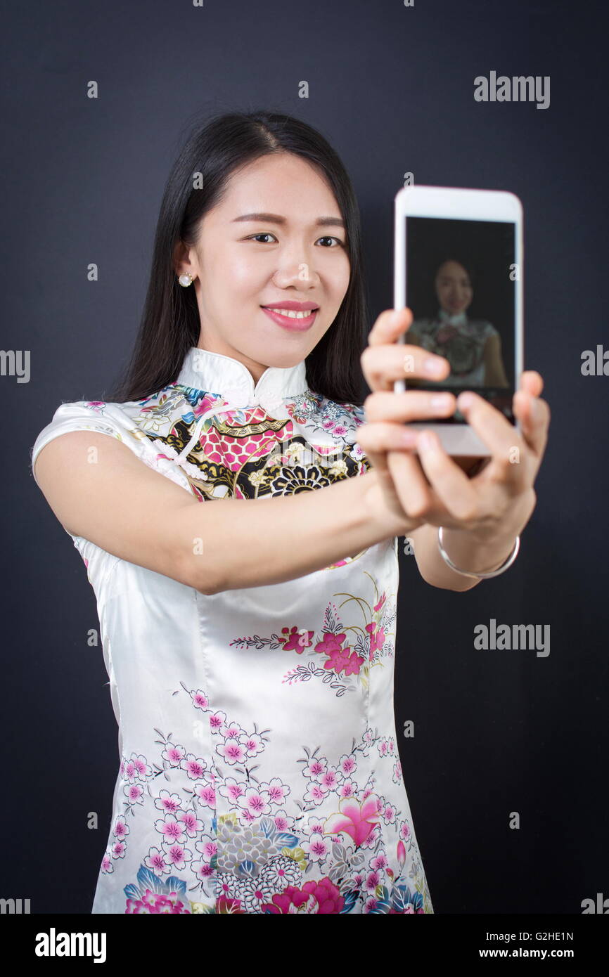 Young woman making a selfie with smart phone device Stock Photo