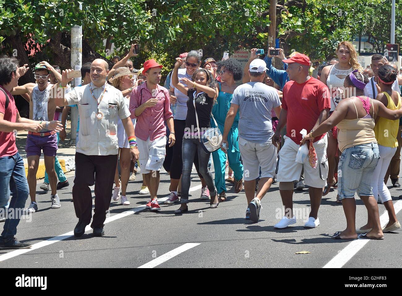 Havana, Havana Cuba, CU. 14th May, 2016. Cuban TV personalities, Facundo and Panfilo, using i-phones to document the parade in support of the Cuban Campaign Against Homophobia as part of the Cuban celebrations for the International Day Against Homophobia and Transphobia, Havana, Cuba, May 14, 2016. © Rory Merry/ZUMA Wire/Alamy Live News Stock Photo