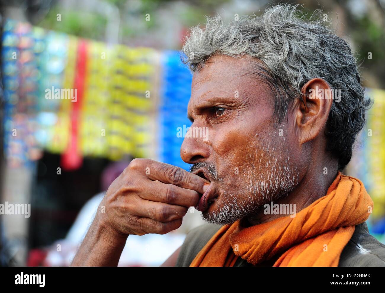 Allahabad, Uttar Pradesh, India. 31st May, 2016. An Indian man chewing