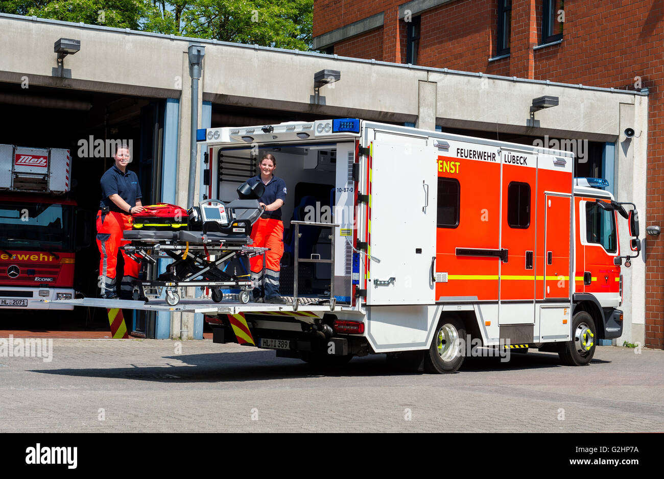 Luebeck, Germany. 30th May, 2016. Rescue assistant Natascha Bock (l) and emergency paramedic Kathleen Borda of the fire briage presenting a new heavy duty ambulance in Luebeck, Germany, 30 May 2016. Two new heavy duty ambulances are in use in Schleswig-Holstein from June onwards. PHOTO: DANIEL BOCKWOLDT/dpa/Alamy Live News Stock Photo
