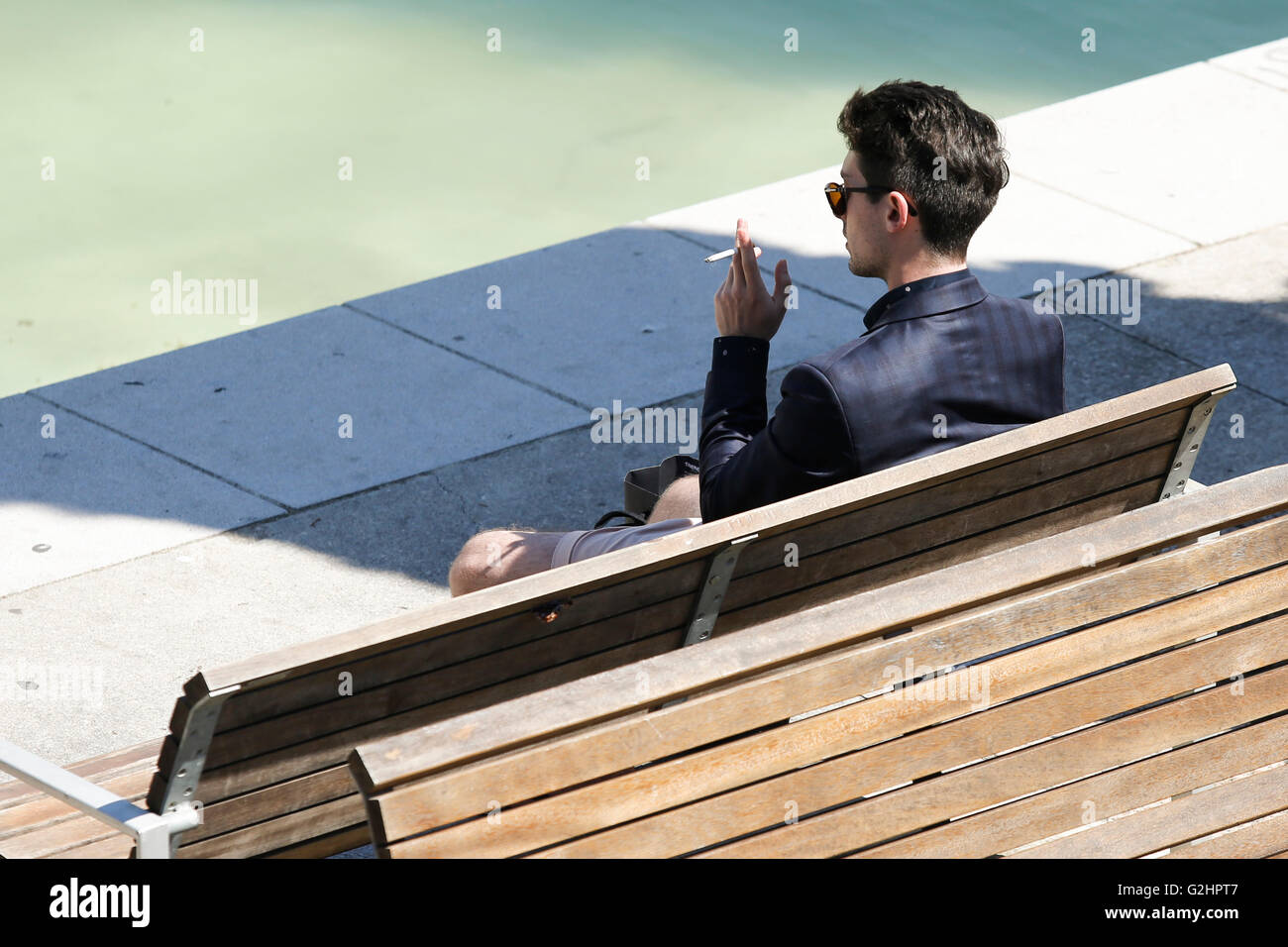 Barcelona, Spain. 31st May, 2016. A man smokes a cigarette in Barcelona