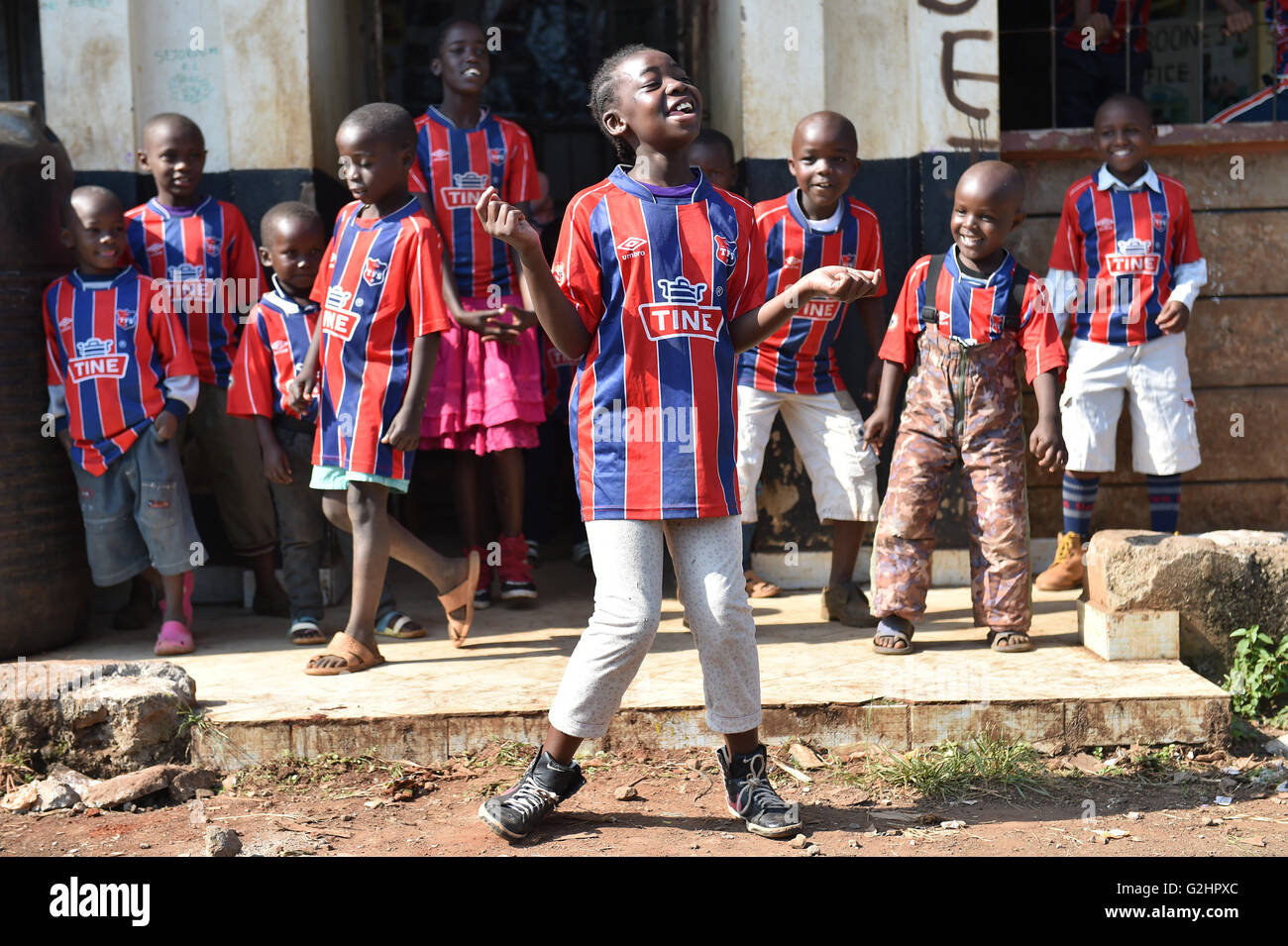 (160531) -- NAIROBI, May 31, 2016 (Xinhua) -- Photo taken on May 29, 2016 shows children singing rap songs and dancing at the Sejorooney Kids Talent Center, at the Mathare slums in Nairobi, Kenya. When the Kenyan duo of Dominic Senerwa and Joseph Mwangi acquired a disused building at the local police post in Mathare slums in Nairobi for philanthropic work, little did they know that their pet project would come to realization. Senerwa, 21, and Mwangi, 23, embarked on their charitable mission to turn around the lives of children from rundown homes within the informal settlement, having grown Stock Photo