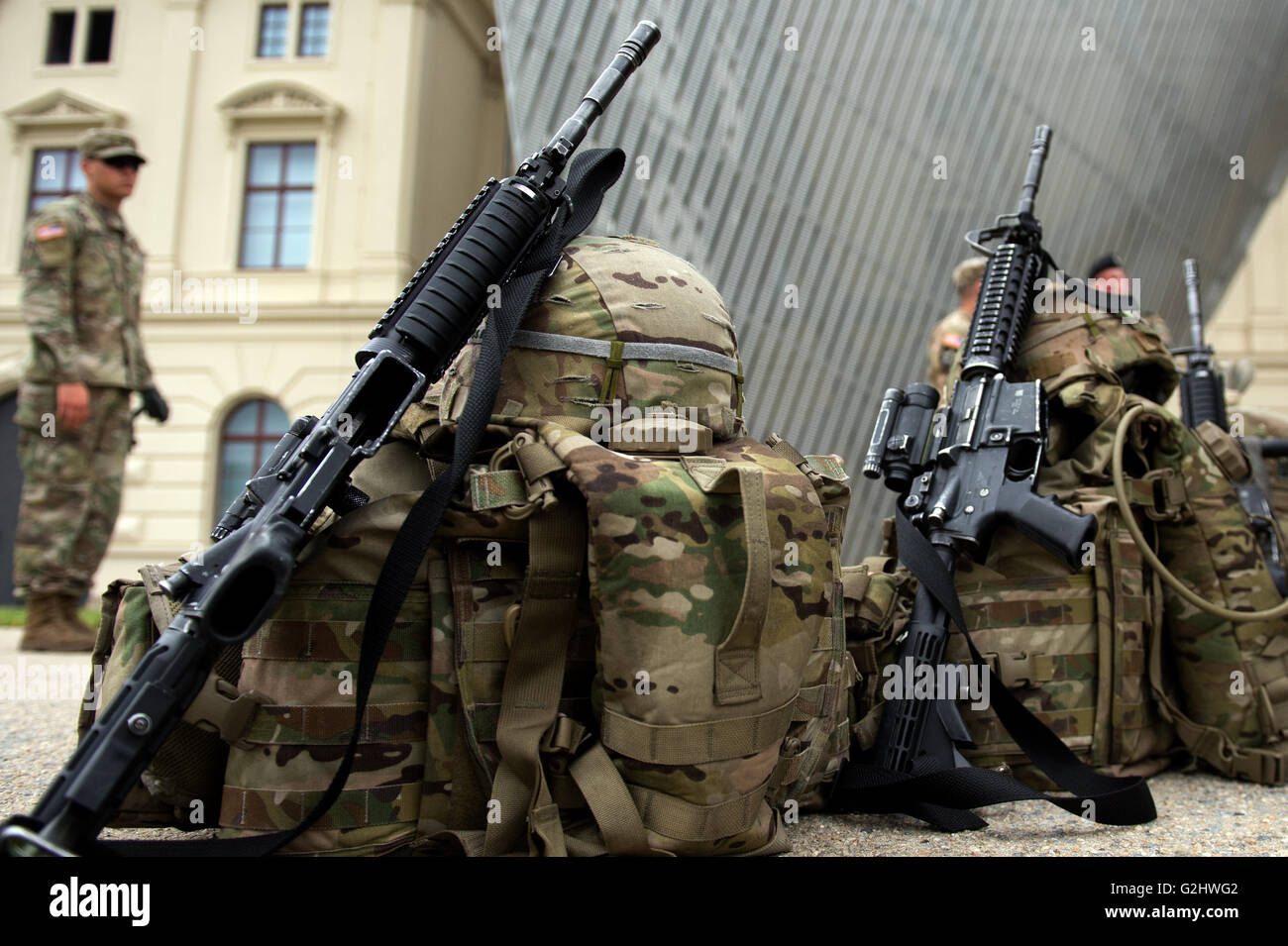 Dresden, Germany. 01st June, 2016. US Army Europe soldiers' luggage and M4 assault rifles can be seen in front of the Military History Museum in Dresden, Germany, 01 June 2016. On the occasion of the NATO operation 'Saber Strike 16' (30 May until 02 June 2016), American Stryker vehicles and current German Armed Forces vehicles will be presented to the public in front of the museum. Photo: ARNO BURGI/dpa/Alamy Live News Stock Photo