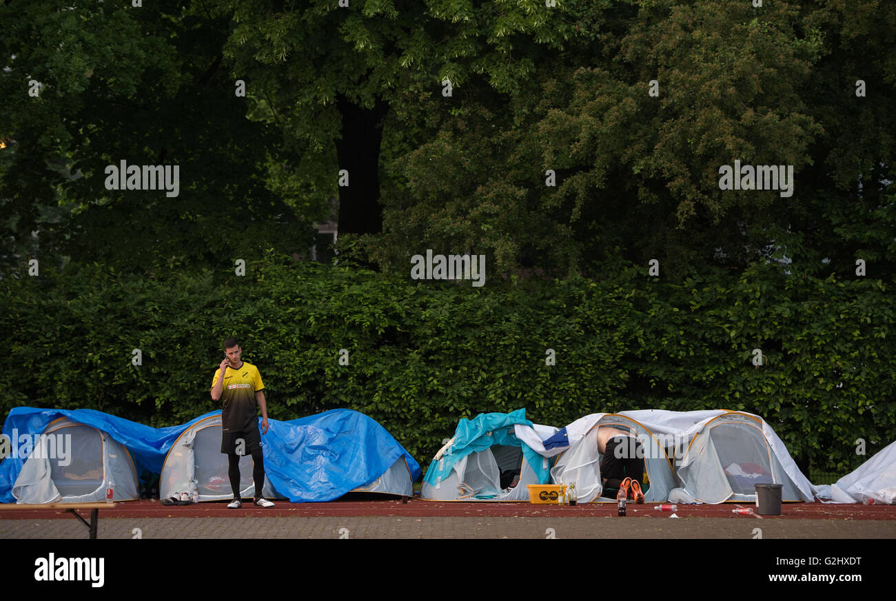 The players of VfL Walhalben stand in front of their tents prior a soccer match between local soccer clubs VfL Wallhalben and vom FC Hamburg Berg  in Hamburg, Germany, 31 May 2016. VfL Wallhalben  and FC Hamburg Berg  are aiming to set a new world record for the longest ever played soccer match for more than 111 hours non-stop. The match starts at 10PM on 31 May and is expected to last until 1PM on 5 June. Photo: Lukas Schulze/dpa Stock Photo