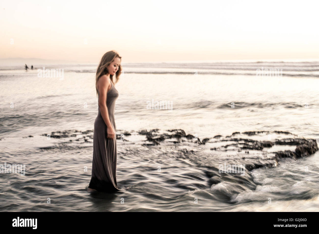 Woman in dress wading in water hi-res stock photography and images - Alamy